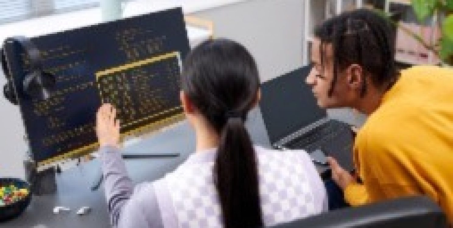 Man helping colleague in the office